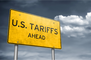 A traffic sign showing US tariffs ahead